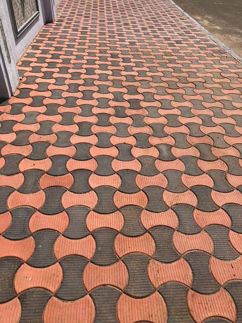 Two-tone interlocking paving on a pedestrian walkway